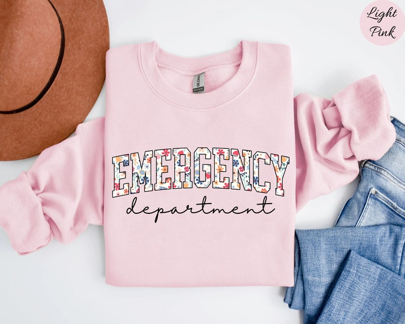 May include: Light pink sweatshirt with the text "EMERGENCY department" in a floral print.