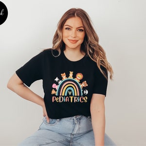 May include: Black t-shirt with a rainbow and animals on it. The text "PEDIATRICS" is below the rainbow.