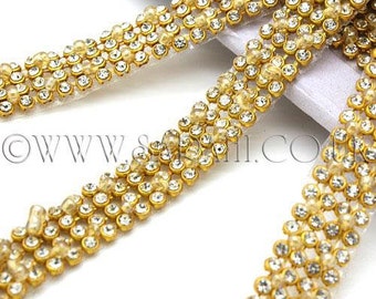 Garniture en perles de cristal dorées