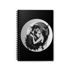 May include: Black and white illustration of a couple kissing in front of a moon. The man has a beard and the woman has long hair. The image is in a circle shape.