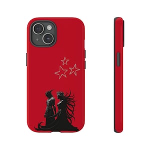 May include: A red phone case featuring a black silhouette of a couple standing in front of three white stars.