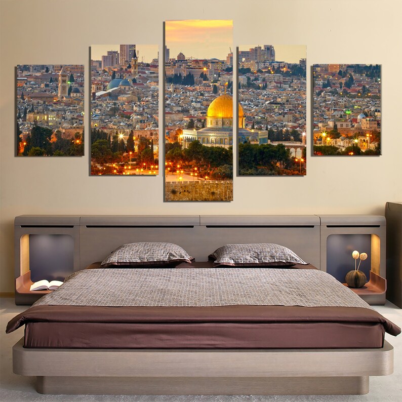 May include: A five-piece canvas print set depicting a panoramic view of Jerusalem at sunset. The Dome of the Rock, a golden-domed mosque, is prominently featured in the center of the image. The cityscape is filled with buildings and trees, creating a vibrant and detailed scene.