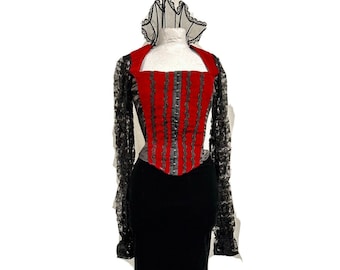 May include: A gothic-style gown with a red and black color scheme. The bodice is red with vertical black accents, and the skirt is black velvet. The sleeves are black lace, and the gown features a ruffled collar and a flared, lace-trimmed hem.