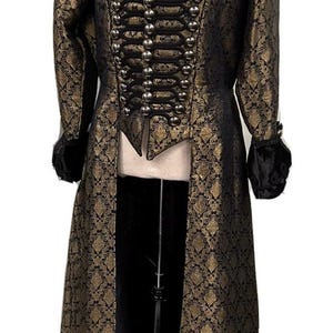 May include: A long black and gold brocade coat with a stand-up collar, silver buttons, and black velvet trim on the cuffs.