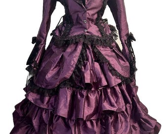 May include: A purple and black Victorian-style dress with a ruffled skirt and lace trim.