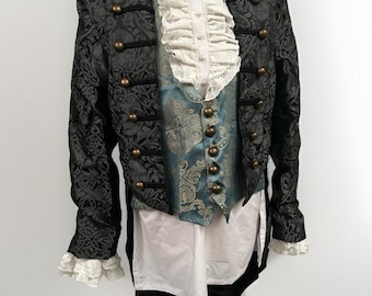 May include: A black and gold patterned jacket with a matching vest and a white ruffled shirt. The jacket has a long tail and gold buttons.