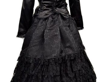 May include: A black satin jacket with a lace trim and a black lace skirt with multiple layers. The jacket has a button closure and a lace-up back.