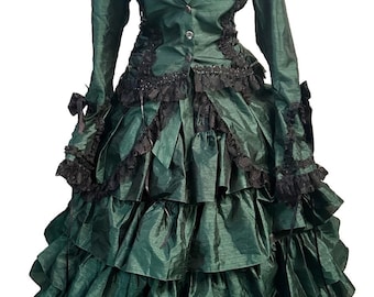 May include: A green and black Victorian-style dress with a ruffled skirt and lace trim.
