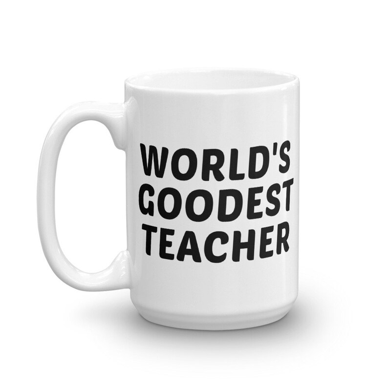 May include: White ceramic mug with the text "WORLD'S GOODEST TEACHER" in bold black letters. The mug has a curved handle and a glossy finish. A perfect gift for teachers.