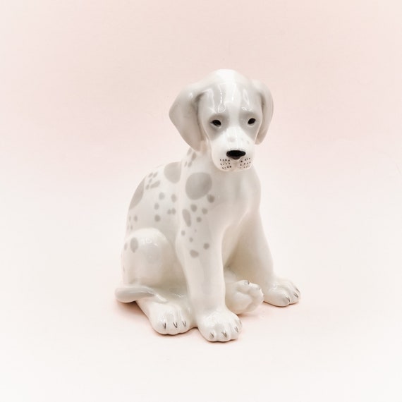 white porcelain dog figurines