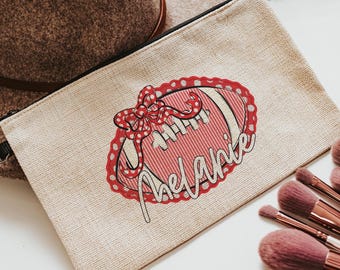 personalized red school spirit wristlet pouch with strap, red seersucker makeup bag for purse, cheer team custom gifts for cheerleaders