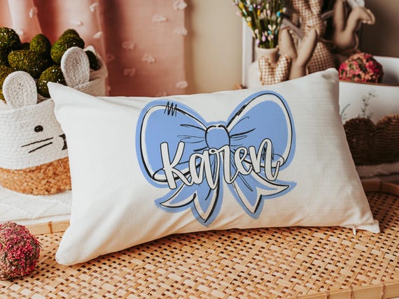 Personalized carolina blue coquette bow name throw pillow