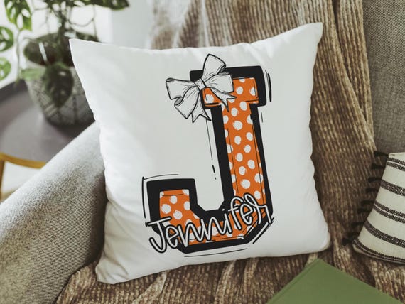 Personalized orange initial pillows