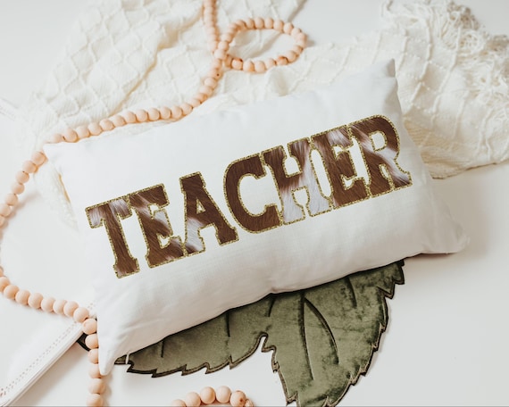 Teacher cow print throw pillow