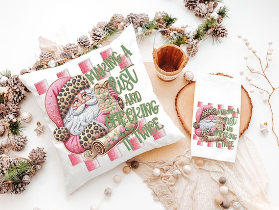 making a list and checking it twice pink Christmas throw pillows for couch, leopard print Santa Claus kitchen towels, sage green Christmas