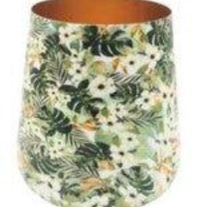 May include: A stemless tumbler featuring a vibrant botanical print with white flowers and dark green tropical leaves against a light background. The interior of the vessel has a smooth, metallic copper finish visible at the top rim.