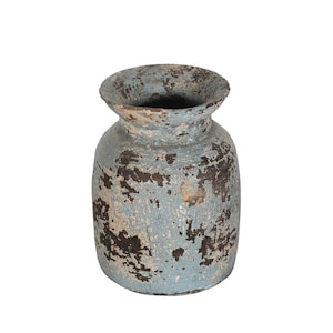 May include: A blue and brown ceramic vase with a distressed finish. The vase has a wide mouth and a rounded body.