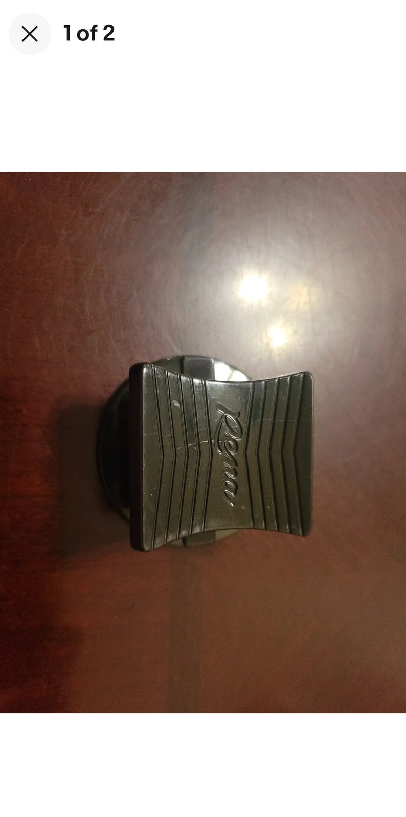 May include: Black plastic bottle stopper with the word "Rema" embossed on the top.