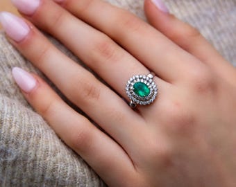 14ct White Gold Emerald & Diamond Halo Ring