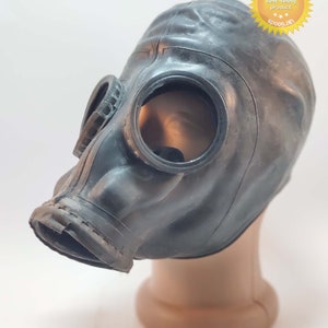 May include: A black rubber gas mask featuring two circular eye lenses and a protruding front filter housing. The mask is displayed on a tan mannequin head. A yellow star-shaped badge in the top right corner contains the text UkrGoods Best-selling product.