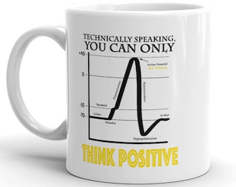 Puede incluir: Taza de cerámica blanca con una ilustración en blanco y negro de un gráfico de potencial de acción neuronal. El texto "Técnicamente hablando, solo puedes pensar positivo" está impreso en negro y amarillo en la taza.