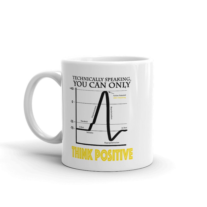 May include: White ceramic mug with a black and white illustration of a neuron action potential graph. The text "Technically speaking, you can only think positive" is printed in black and yellow on the mug.