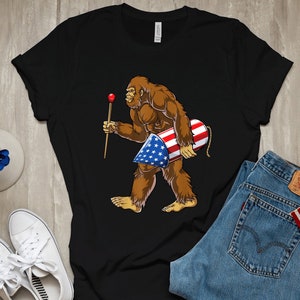 Bigfoot 4th July Shirt, 4th of July Sasquatch Firework Tee, Patriotic Yeti Hunter Shirt, Camper Independence Day Gift, USA Flag Yeti Shirt