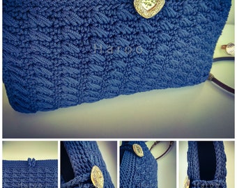 Blue wallet bag with golden clasp.