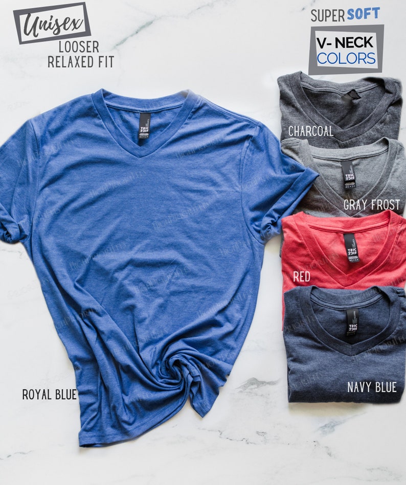 May include: A variety of V-neck t-shirts in different colors, including royal blue, charcoal, red, gray frost, and navy blue. The shirts are made of a soft, comfortable fabric and have a looser, relaxed fit.  Unisex.