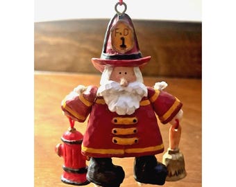 Adorno navideño de bombero de Kurt Adler, tallado en madera, arte popular primitivo.