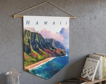 May include: A wall hanging banner featuring a scenic view of Hawaii. The banner displays a coastal landscape with green mountains, a sandy beach, and blue ocean waters. The word "HAWAII" is printed across the top in navy blue letters. The banner is suspended from a wooden rod.
