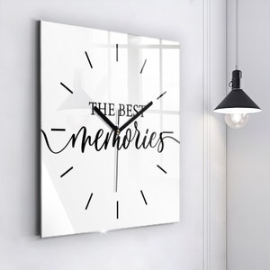 May include: White square clock with black hands and the text "THE BEST memories" in black script.