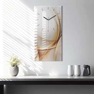 May include: A modern wall clock with a white background and brown abstract lines. The clock face has black hands and black Roman numeral markings.