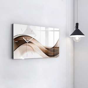 May include: A modern wall clock with a white background and brown abstract waves. The clock has a clear glass face and white hands.
