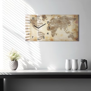 May include: A world map clock with a distressed, vintage look. The clock face is overlaid on a map of the world with a brown and beige color scheme. The clock hands are black.