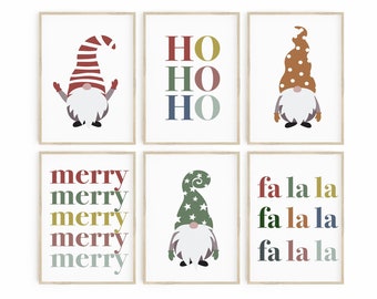 May include: Set of six printable Christmas gnome illustrations. The illustrations feature gnomes with different colored hats and a variety of Christmas phrases, including "Ho Ho Ho", "Merry", and "Fa La La".