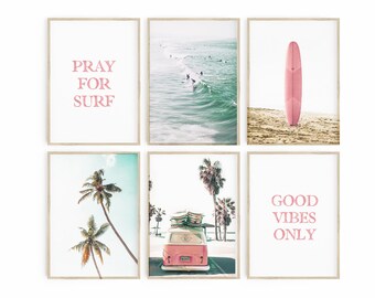 May include: Set of six framed prints with a beach theme. The prints feature a pink surfboard, a vintage van with palm trees, a beach scene with surfers, and text that reads "Pray for Surf" and "Good Vibes Only".
