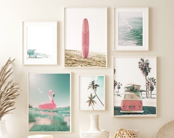 May include: A set of six framed prints with a beach theme. The prints feature a pink surfboard, a pink flamingo float, a vintage van, palm trees, and a lifeguard stand.
