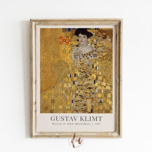 May include: A framed print of Gustav Klimt's painting "Portrait of Adele Bloch-Bauer" featuring a woman in a gold dress with a geometric pattern against a gold background. The text "Gustav Klimt" and "Portrait of Adele Bloch-Bauer | 1907" is printed below the image.