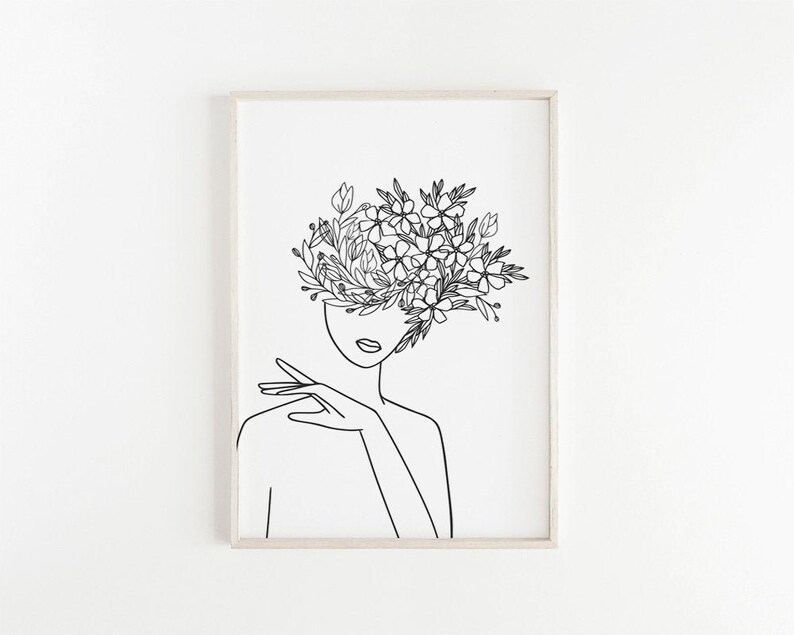May include: Line art drawing of a person with flowers growing out of their head. The drawing is in black and white and is framed.