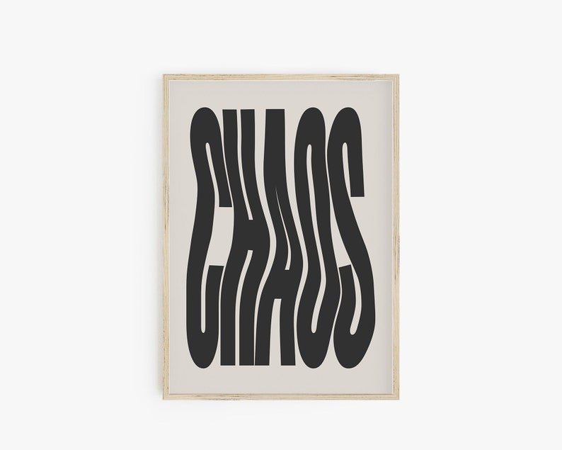May include: A framed print with a black and white design of the word "CHAOS" in a stylized font.