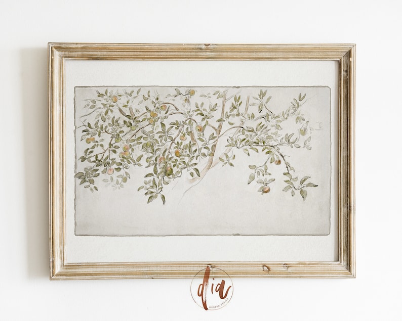 May include: A framed watercolor painting of a tree branch with green leaves and small yellow fruit. The painting is on a light gray background and is framed in a light wood frame.