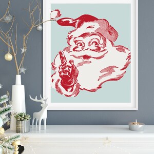 May include: A vintage-style illustration of Santa Claus in red and white, with a blue background. He is pointing with his index finger and has a friendly expression.