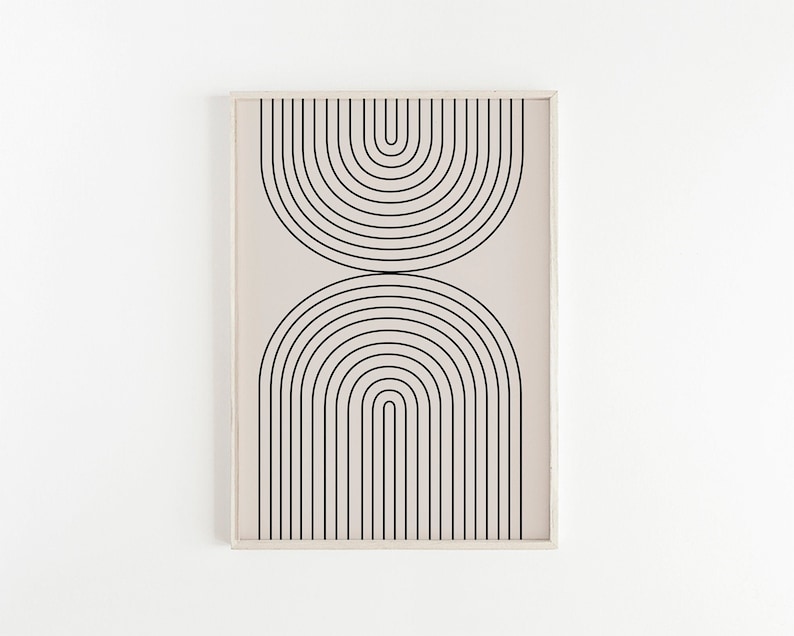 May include: A framed print with a minimalist design featuring black concentric arches on a light beige background.