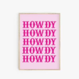 May include: A pink framed print with the word "HOWDY" repeated five times in a bold, pink font.