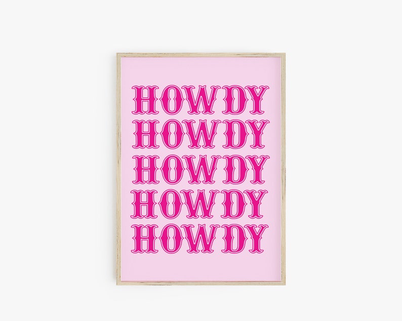 May include: A pink framed print with the word "HOWDY" repeated five times in a bold, pink font.