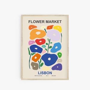 May include: A colorful abstract print with the text "FLOWER MARKET LISBON" and the words "PRINT COLLECTION NO. 11 APRIL 2018". The print features a variety of colorful flowers in a modern style.
