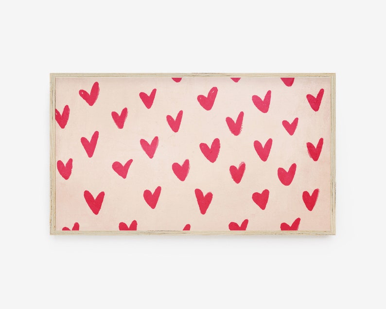 May include: A framed print with a pink background and a repeating pattern of red hearts.