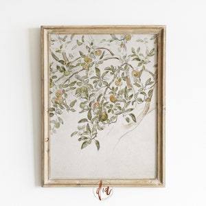May include: A framed watercolor painting of a tree branch with green leaves and orange apples. The background is a light beige color.