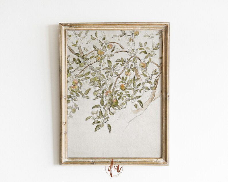 May include: A framed watercolor painting of a tree branch with green leaves and orange apples. The background is a light beige color.